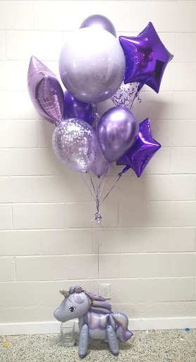 Sitting Unicorn with Ideal Purple Balloon Bunch